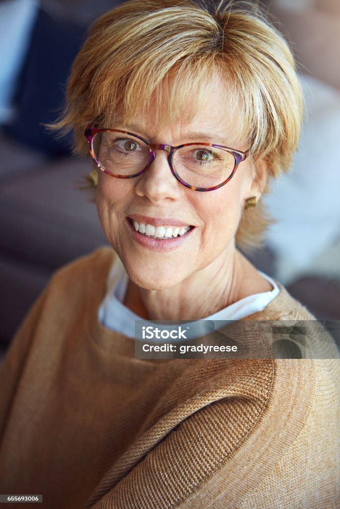 portrait of a happy mature woman relaxing at home
